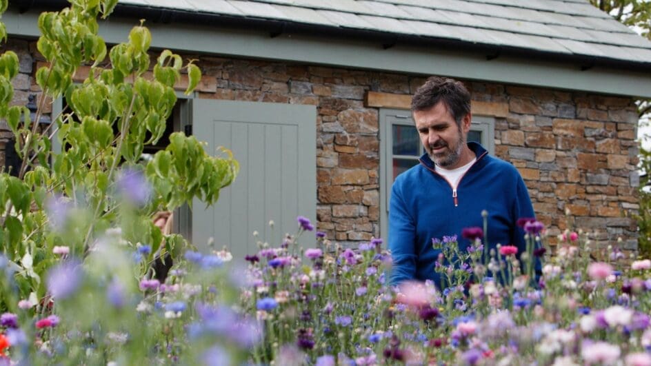 Gardeners' World presenter - Adam Frost in his garden