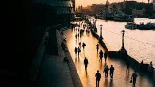 People walking in London in the early evening