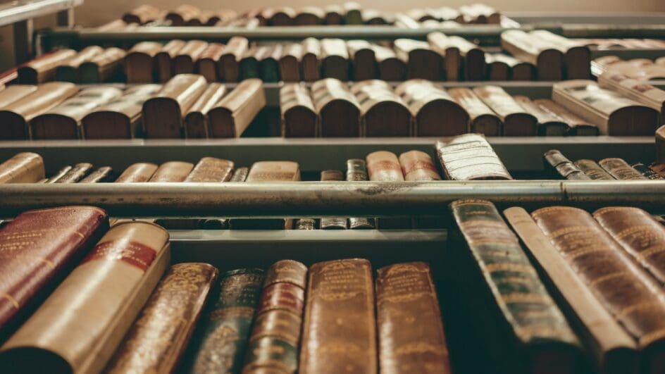 Books on a shelf photographed from below