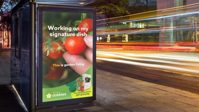 Mock up of vertical light box in a bus stop at night for the new Dobbies campaign