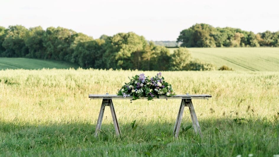 Farewell flower bouquet, consisting of natural wild flowers in purple and white for a funeral by the Featherstones English Flower Company.