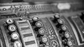 a close up of an old fashioned cash register