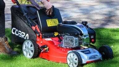 Woman operating the Cobra's new VX mower range