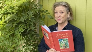 Caroline Quentin with her book entitled Drawn to the Garden