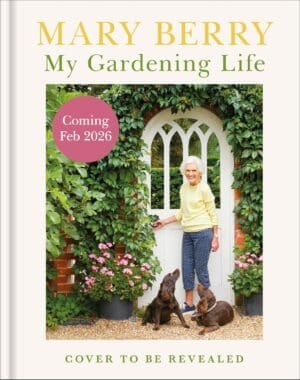 Book cover for Mary Berry's new book entitled My Gardening Life. She is standing in front of her front door, surrounded by by climbing plants