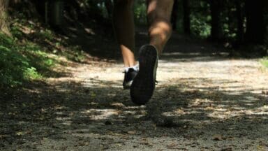 Jogger running on a park path